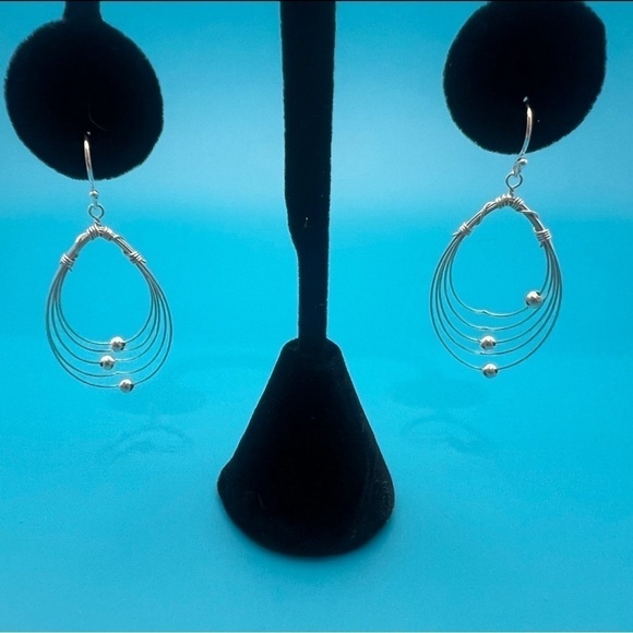 Multi Hoops with moving silver balls dangle earrings. - Picture 7 of 12